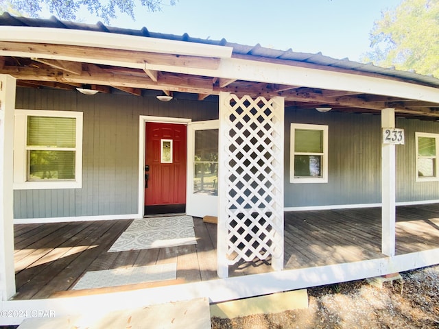 property entrance with a wooden deck