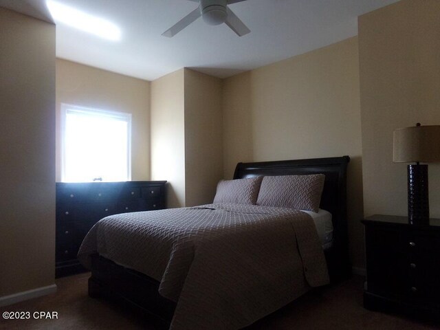 carpeted bedroom with ceiling fan