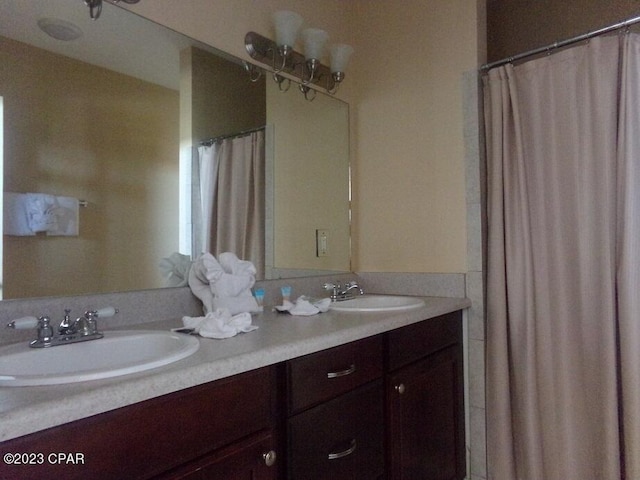 bathroom featuring vanity and walk in shower