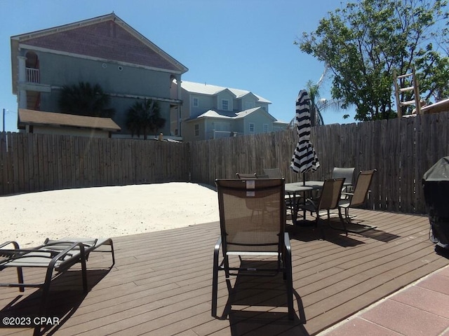 wooden deck with grilling area