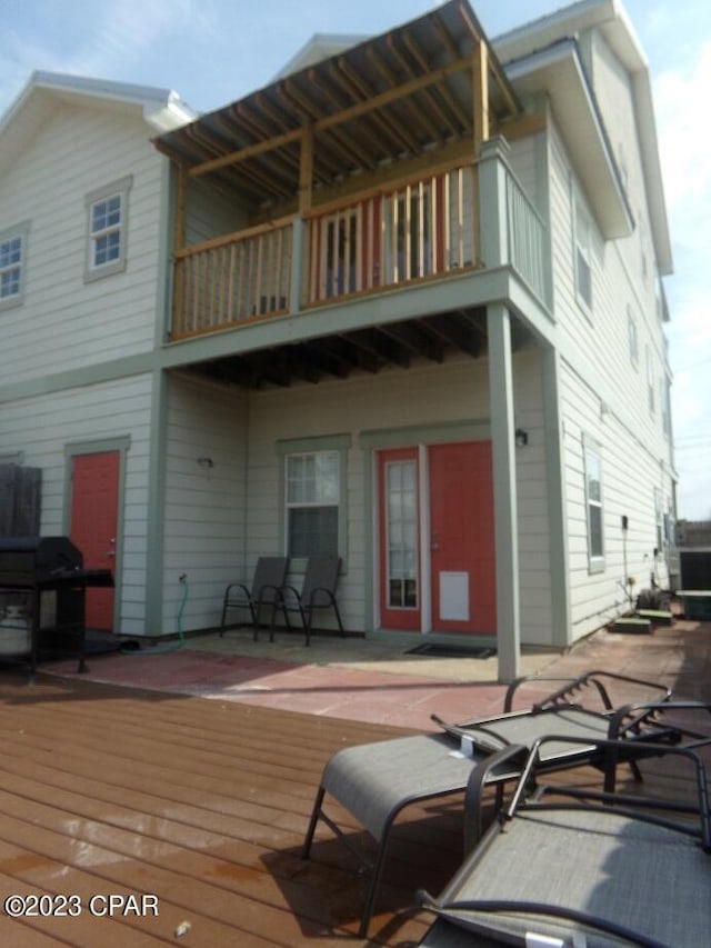 back of property with a deck