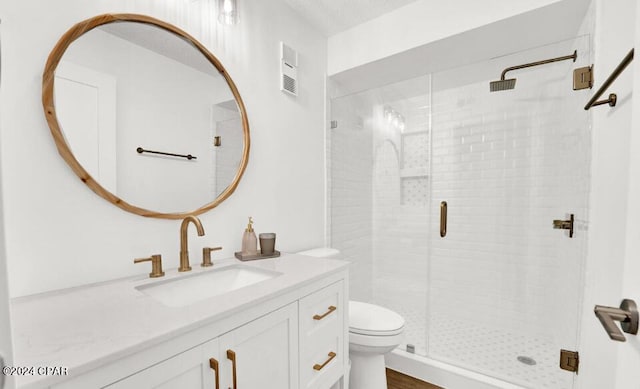 5801 Thomas Dr Unit 501, Panama City, FL 32408 - full bath featuring toilet, a shower stall, vanity, and wood finished floors