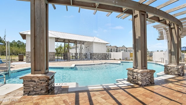 view of pool with a patio and a pergola