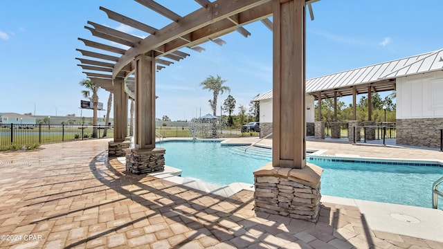 view of pool with a patio area and a pergola