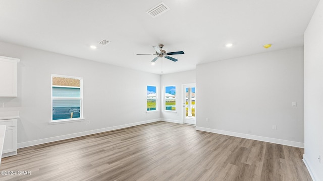 unfurnished room with ceiling fan and light hardwood / wood-style flooring