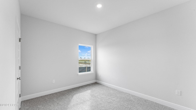 unfurnished room featuring carpet