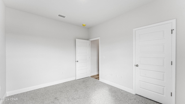 unfurnished bedroom featuring carpet