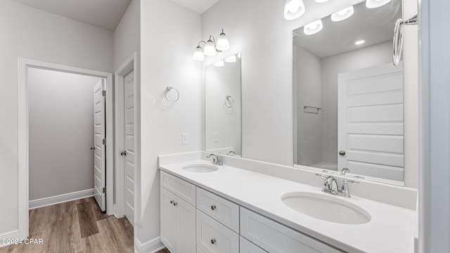 bathroom featuring hardwood / wood-style floors and vanity