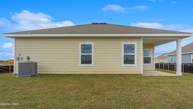 back of house with a yard, a patio, and central AC unit