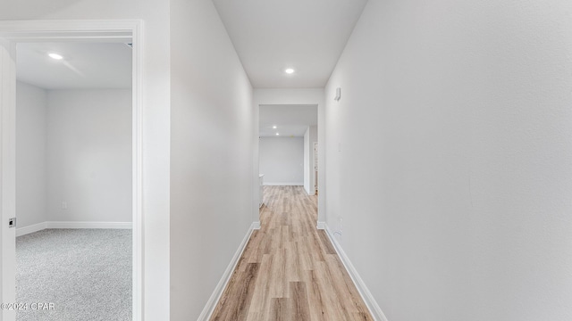 corridor with light wood-type flooring