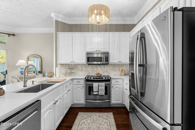 kitchen with sink, appliances with stainless steel finishes, dark wood-type flooring, and white cabinets