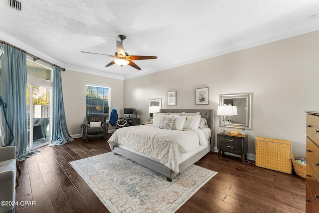 bedroom featuring crown molding, a textured ceiling, ceiling fan, and dark hardwood / wood-style flooring