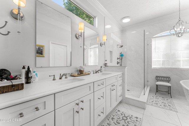 bathroom with independent shower and bath, ornamental molding, vanity, a chandelier, and a textured ceiling