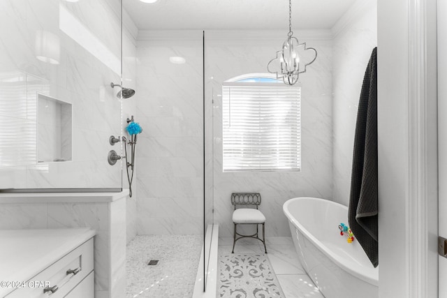 bathroom with vanity, an inviting chandelier, and shower with separate bathtub