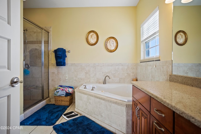 bathroom with separate shower and tub, tile patterned flooring, and vanity