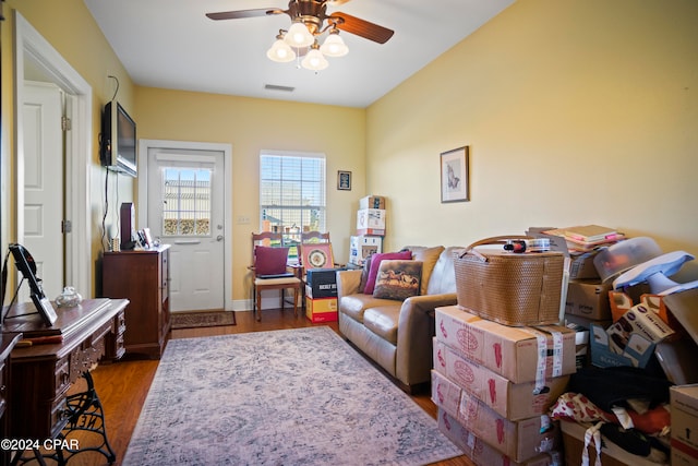 sitting room featuring dark hardwood / wood-style flooring and ceiling fan