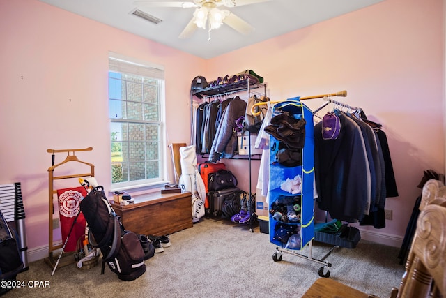 interior space featuring ceiling fan and carpet