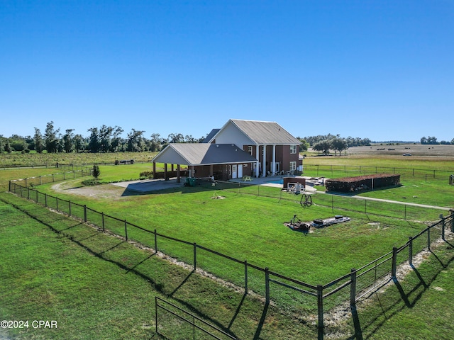 view of yard featuring a rural view and a patio