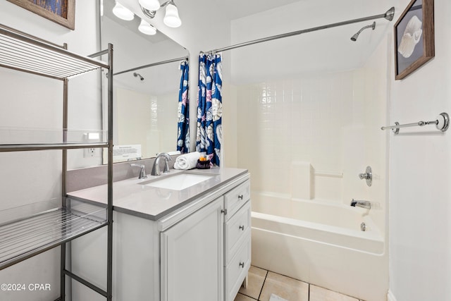 bathroom featuring vanity, shower / bath combo with shower curtain, and tile patterned flooring