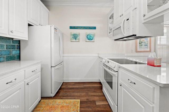 kitchen with white cabinets, tasteful backsplash, dark hardwood / wood-style floors, crown molding, and white appliances