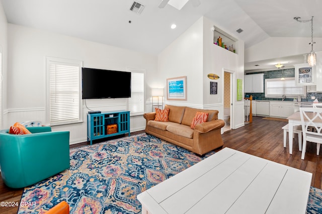 living room with ceiling fan, high vaulted ceiling, sink, and dark hardwood / wood-style floors