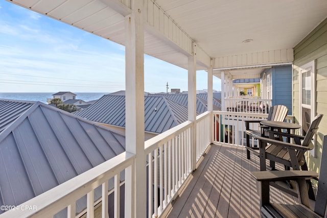 wooden deck with a water view