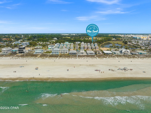 bird's eye view featuring a view of the beach and a water view