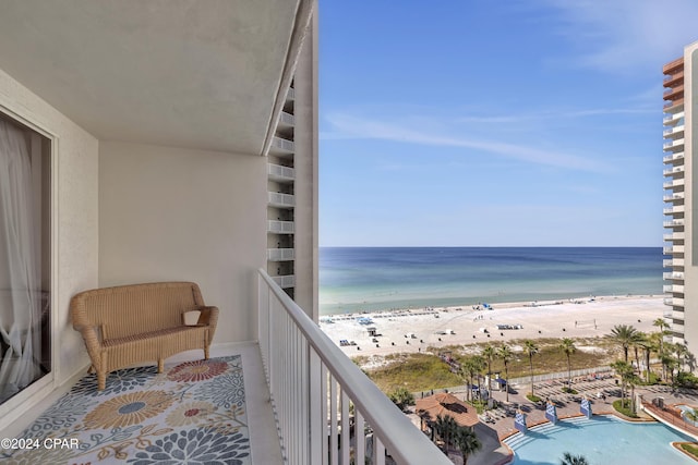 balcony with a view of the beach and a water view