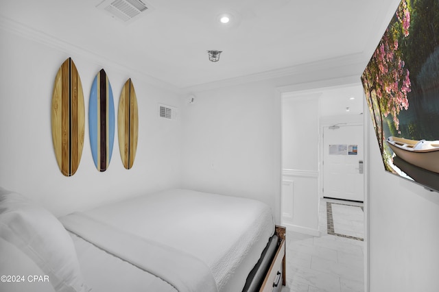 bedroom featuring crown molding