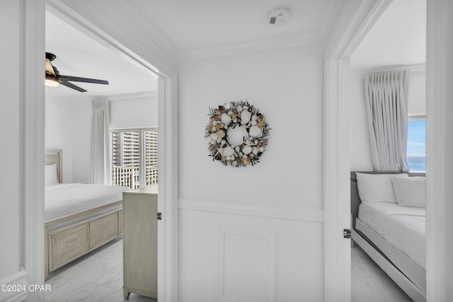 bedroom featuring crown molding and ceiling fan