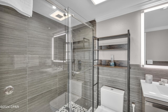 bathroom featuring toilet, an enclosed shower, crown molding, tile walls, and vanity