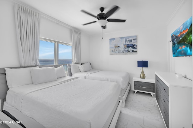 bedroom with a water view, ceiling fan, and crown molding