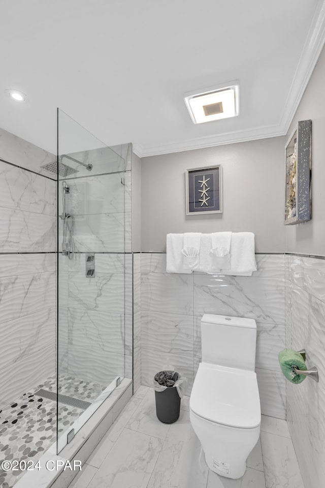 bathroom featuring a tile shower, ornamental molding, tile walls, and toilet