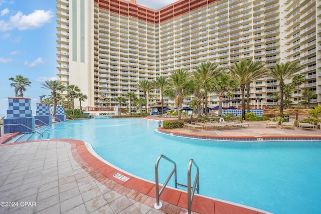 view of swimming pool featuring a patio area