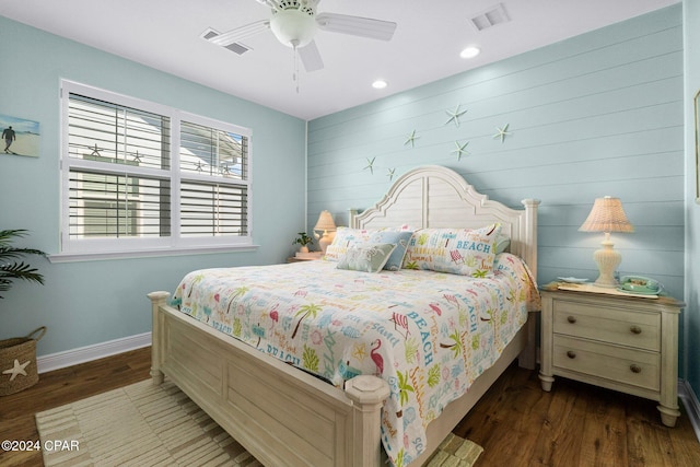 bedroom with ceiling fan and dark wood-type flooring