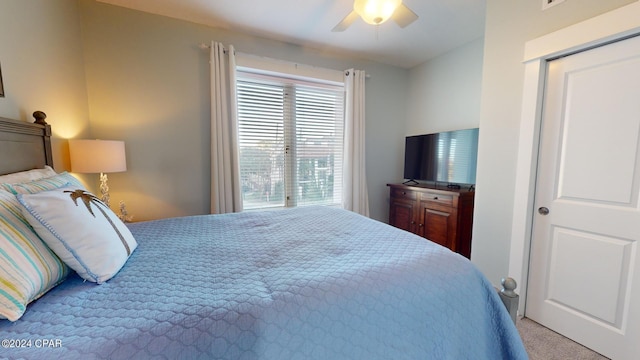 carpeted bedroom with a ceiling fan