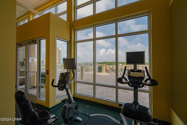 exercise room featuring a drop ceiling