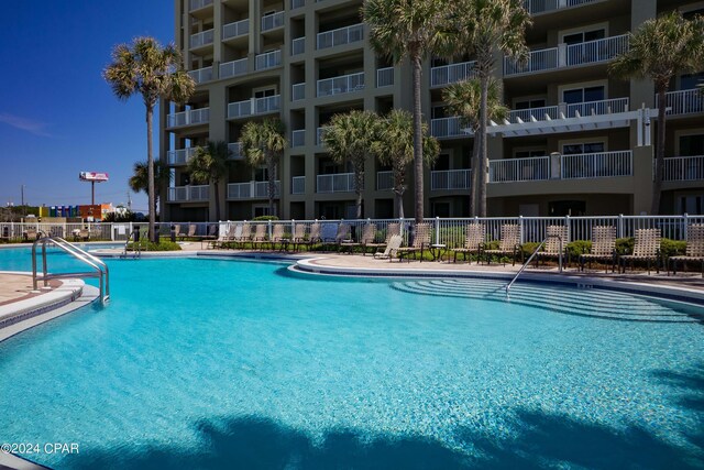 view of pool with a community hot tub