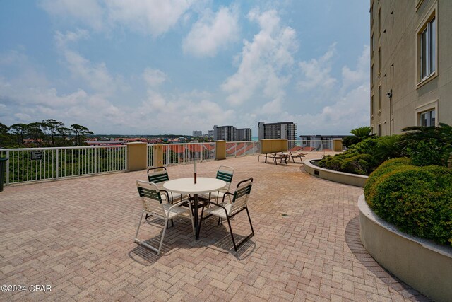 view of swimming pool with a hot tub and a patio area