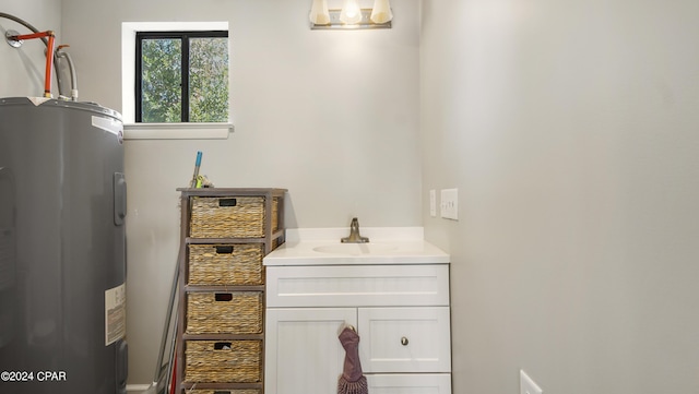 bathroom with electric water heater and vanity