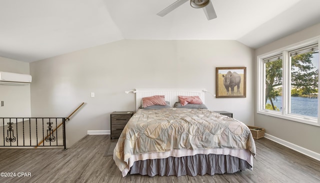 bedroom featuring a wall mounted air conditioner, wood-type flooring, ceiling fan, and lofted ceiling