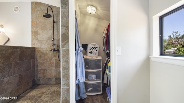 bathroom with tiled shower