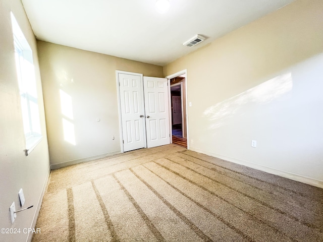 unfurnished bedroom featuring carpet