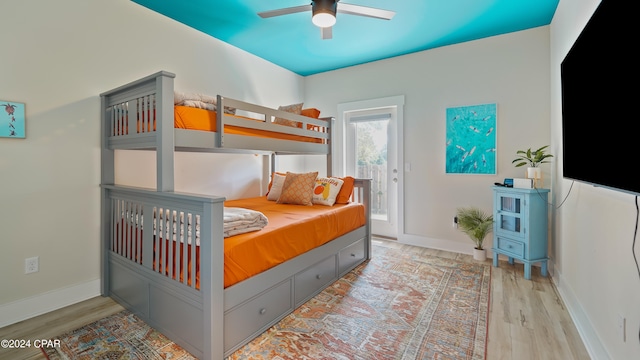 bedroom featuring ceiling fan and light hardwood / wood-style flooring