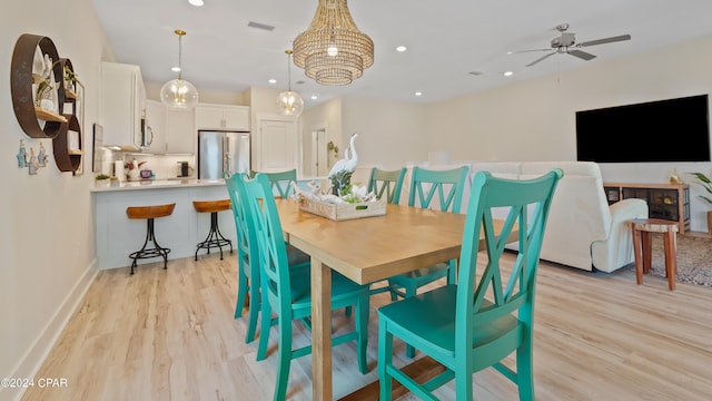 dining space featuring light hardwood / wood-style flooring and ceiling fan