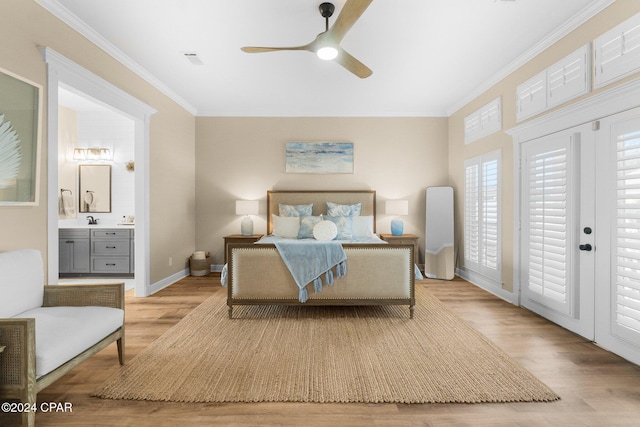 bedroom featuring visible vents, baseboards, ornamental molding, ensuite bathroom, and light wood-style floors