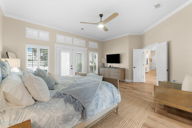 bedroom with visible vents, light wood-style floors, access to exterior, ornamental molding, and french doors