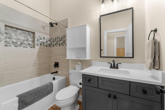 full bathroom featuring tub / shower combination, vanity, and toilet