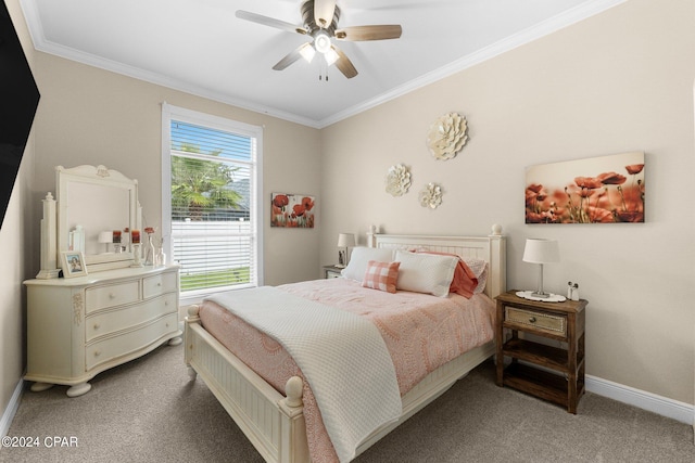 carpeted bedroom with baseboards, ceiling fan, and crown molding