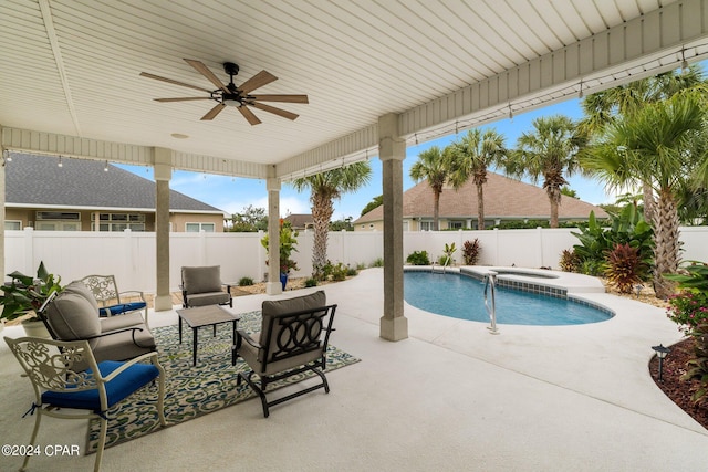 view of pool featuring ceiling fan, a fenced backyard, an in ground hot tub, a fenced in pool, and a patio area